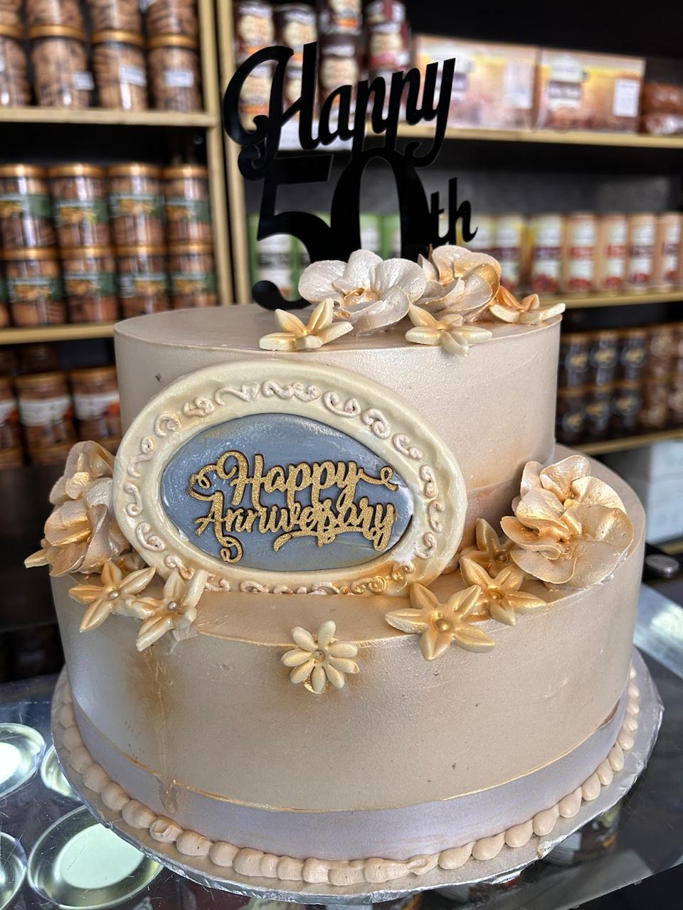 50th Anniversary Soft Pink Buttercream Flowers Cake | Doon Memories