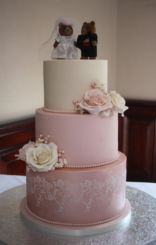 3 tier wedding cake with ivory and pink sugar roses