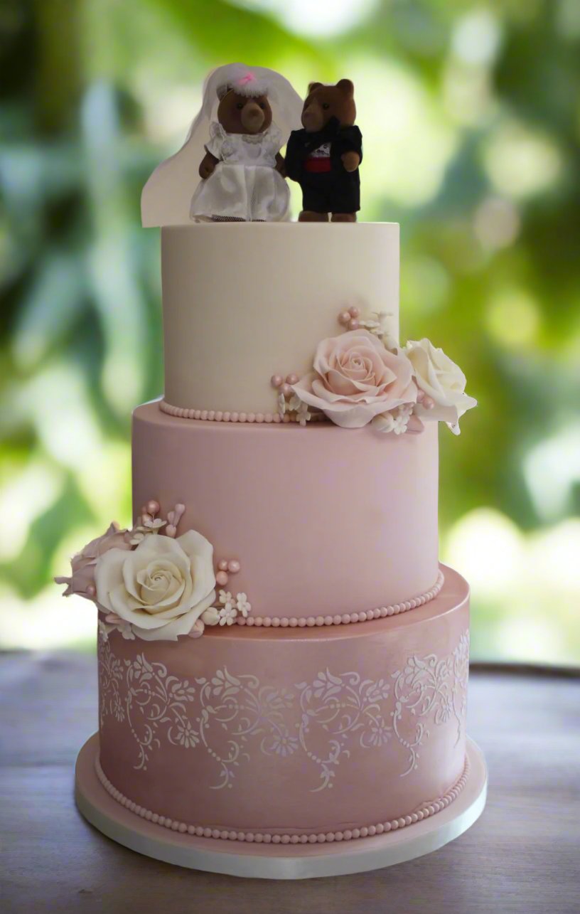 3 tier wedding cake with ivory and pink sugar roses
